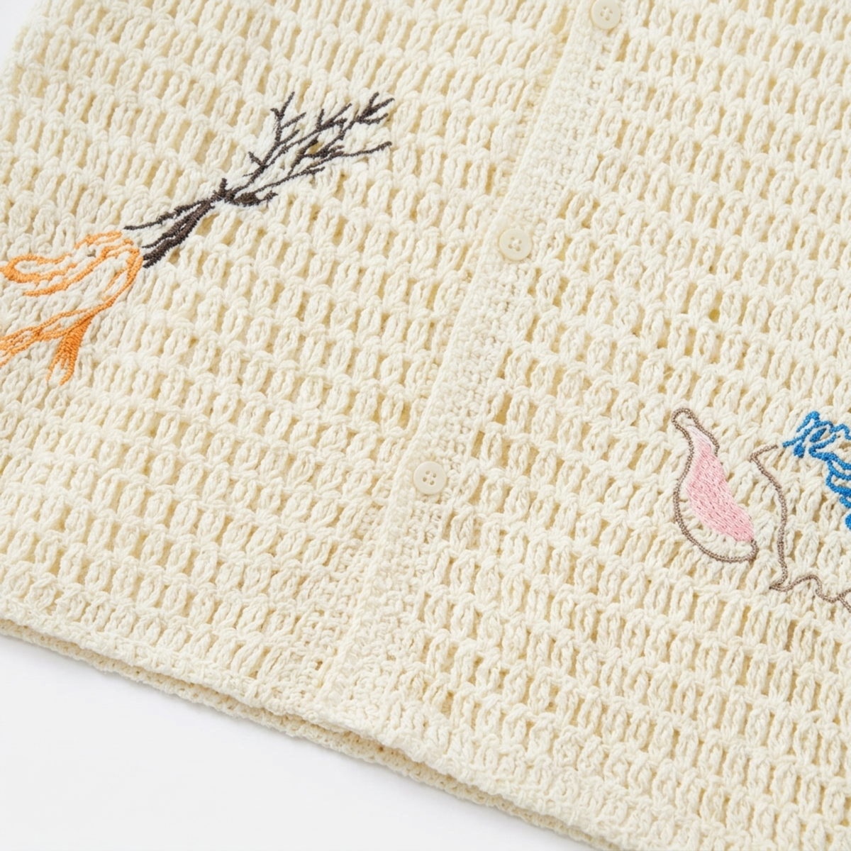Polo crocheté homme — broderie botanique — style resort estival
